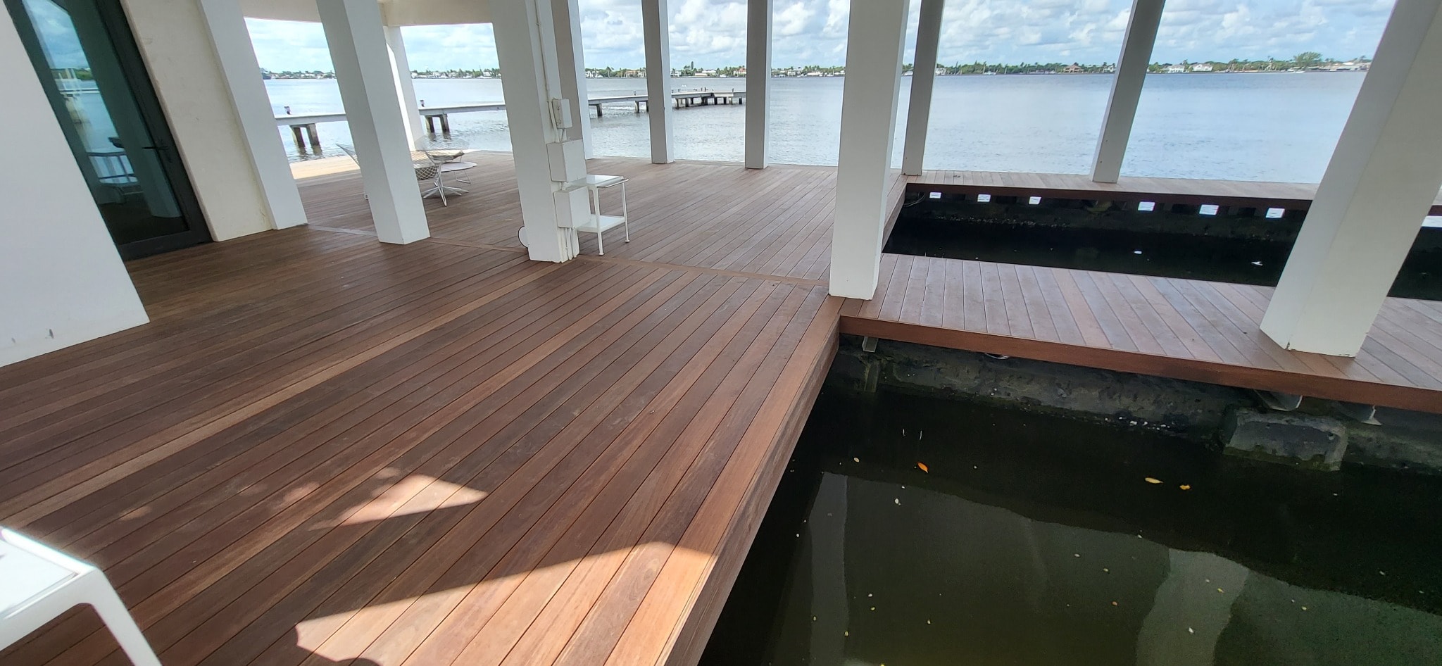 Hardwood deck built around a water feature — complex structural conditions